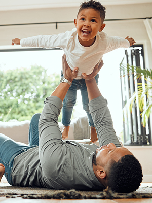 father playing with his son