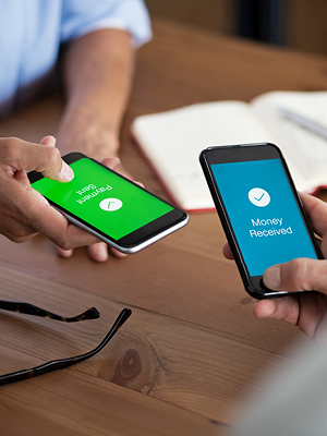 two people with phones