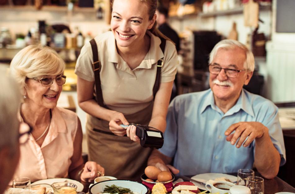 family paying at a restaurant