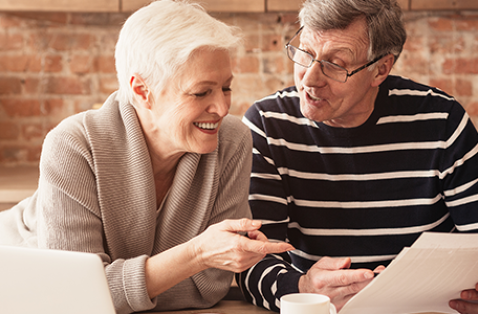 picture of a couple looking at a piece of paper