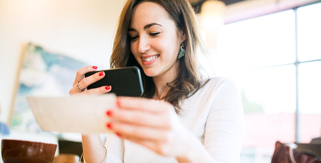 Person making a mobile deposit with their phone. 