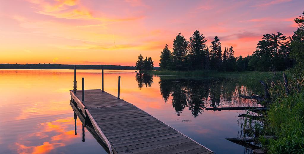 dock leading out to a lake