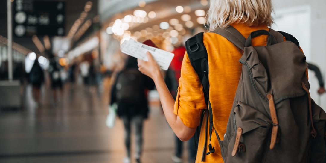 a woman walking through the airport
