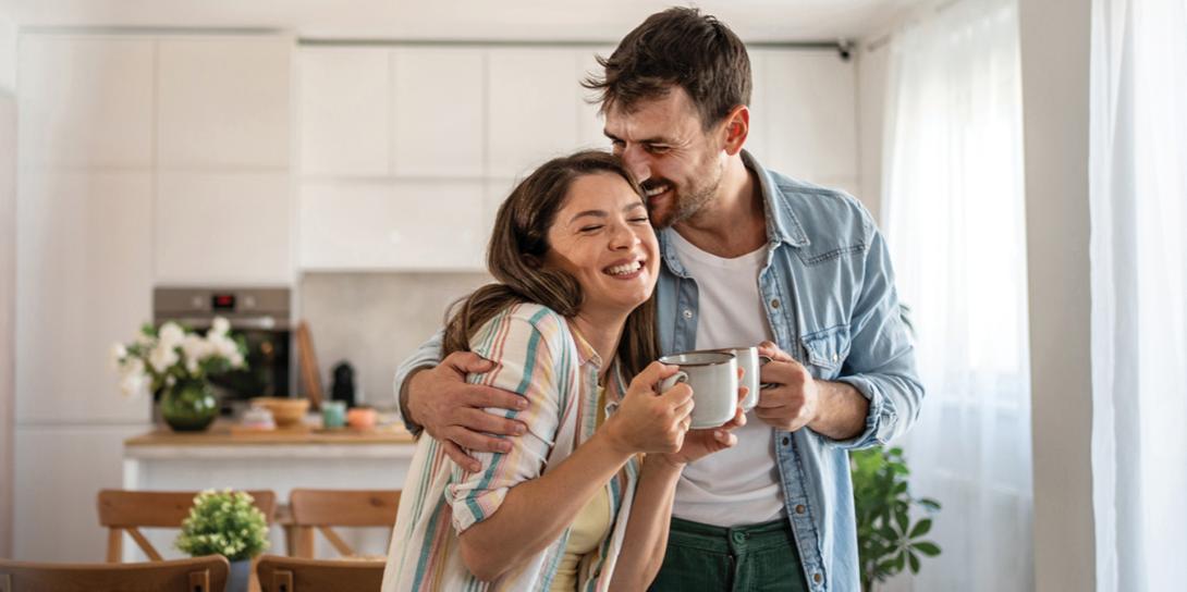 Couple drinking coffee and laughing